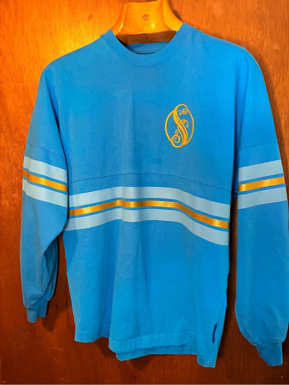 Universal Bright Blue Crewneck Sweater with Gold Stripe Accents